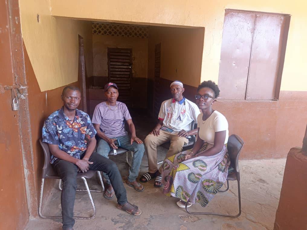 Some of the Congo Town residents who took the case to court discuss with community organizers.